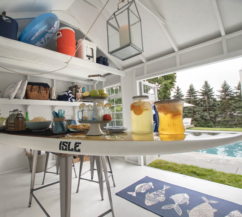 Shed with bar by pool for storage.